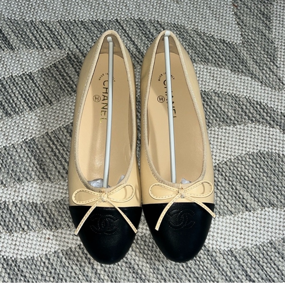 CHANEL Tan and Black Flats Timeless Elegance